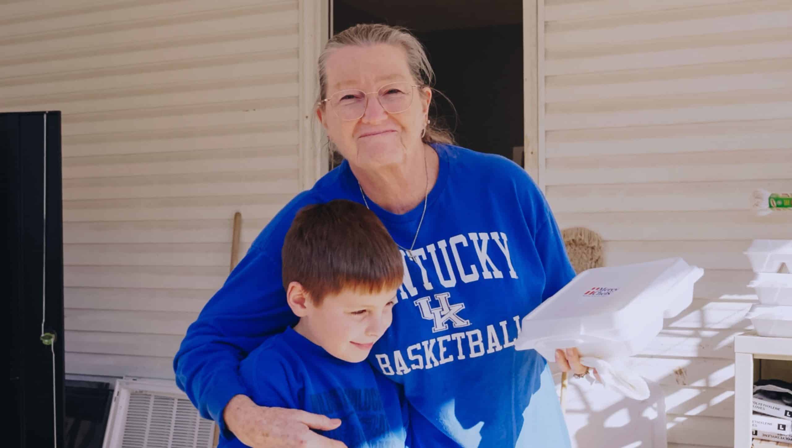 Woman and child receiving Mercy Chefs meals in Mississippi.